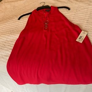 Dark pink sleeveless flowing shirt